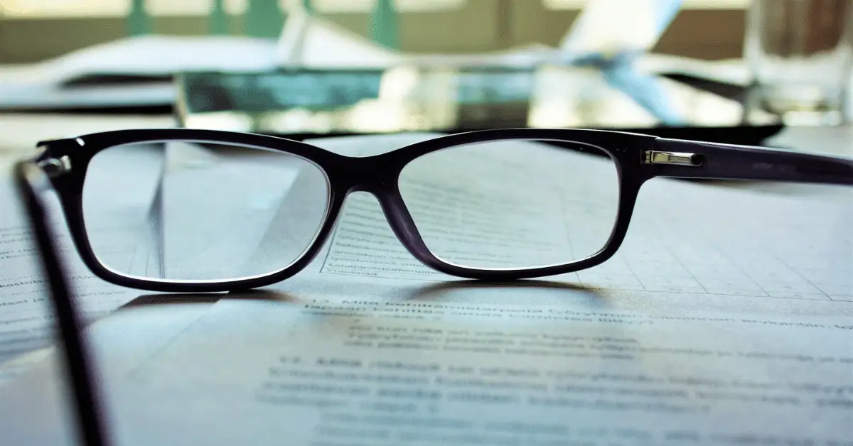 eyeglasses on a lease agreement contract