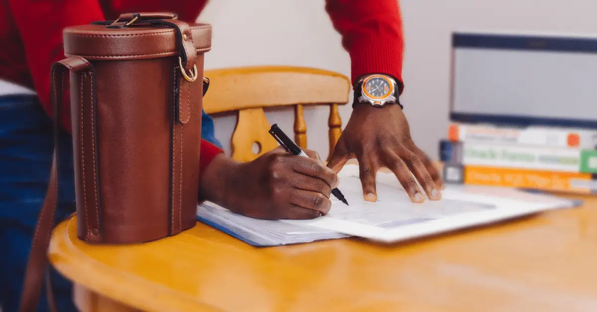 Man signing a lease contract